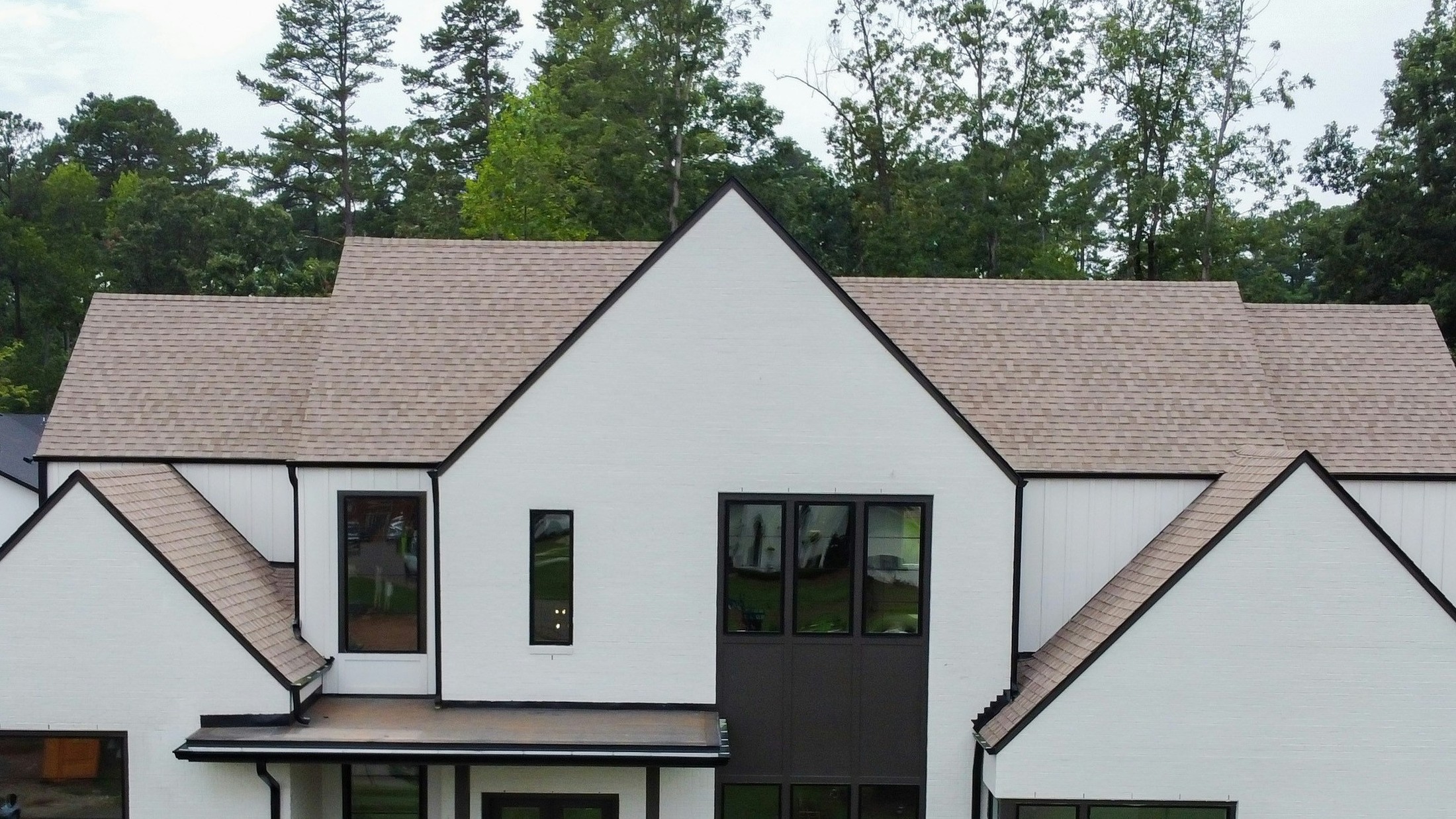 Detail of a custom home's rooflines and gables