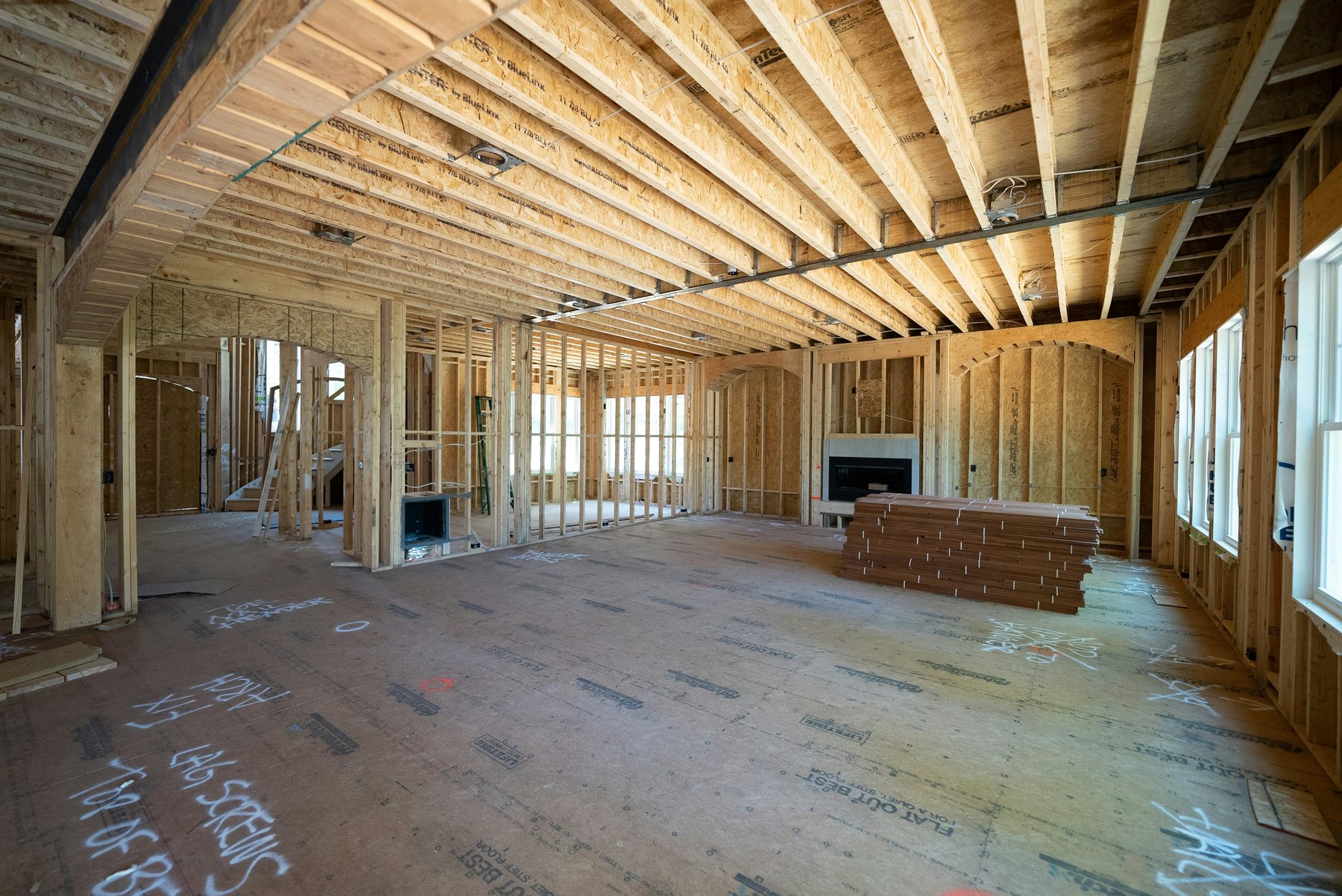 Framed great room of a custom home under construction