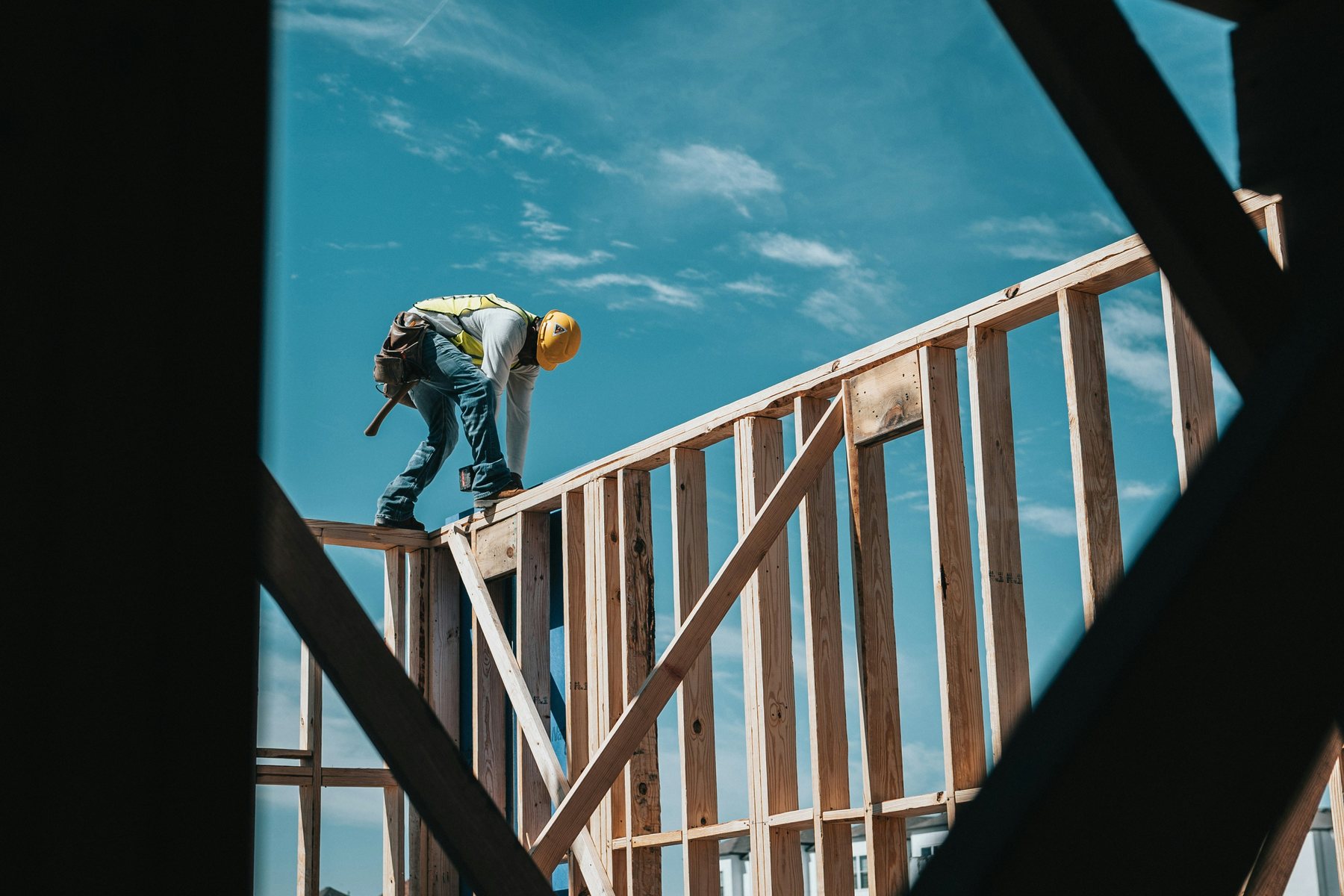 Construction blueprints and site plans spread out for trade coordination